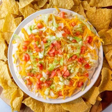 taco dip made with cream cheese, sour cream, and a taco seasoning packet