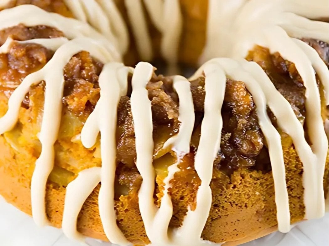 easy fall dessert Bundt Cake made with pumpkin, apples, and cream cheese glaze