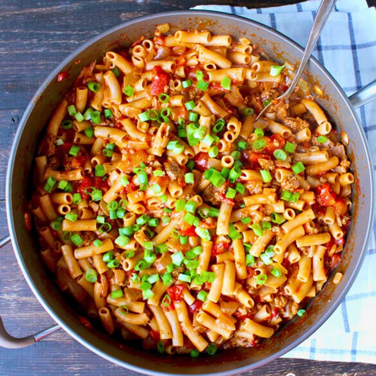 overhead photo of easy one-pot American goulash garnished with green onion