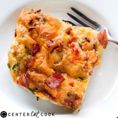 piece of egg and bacon breakfast casserole with a fork