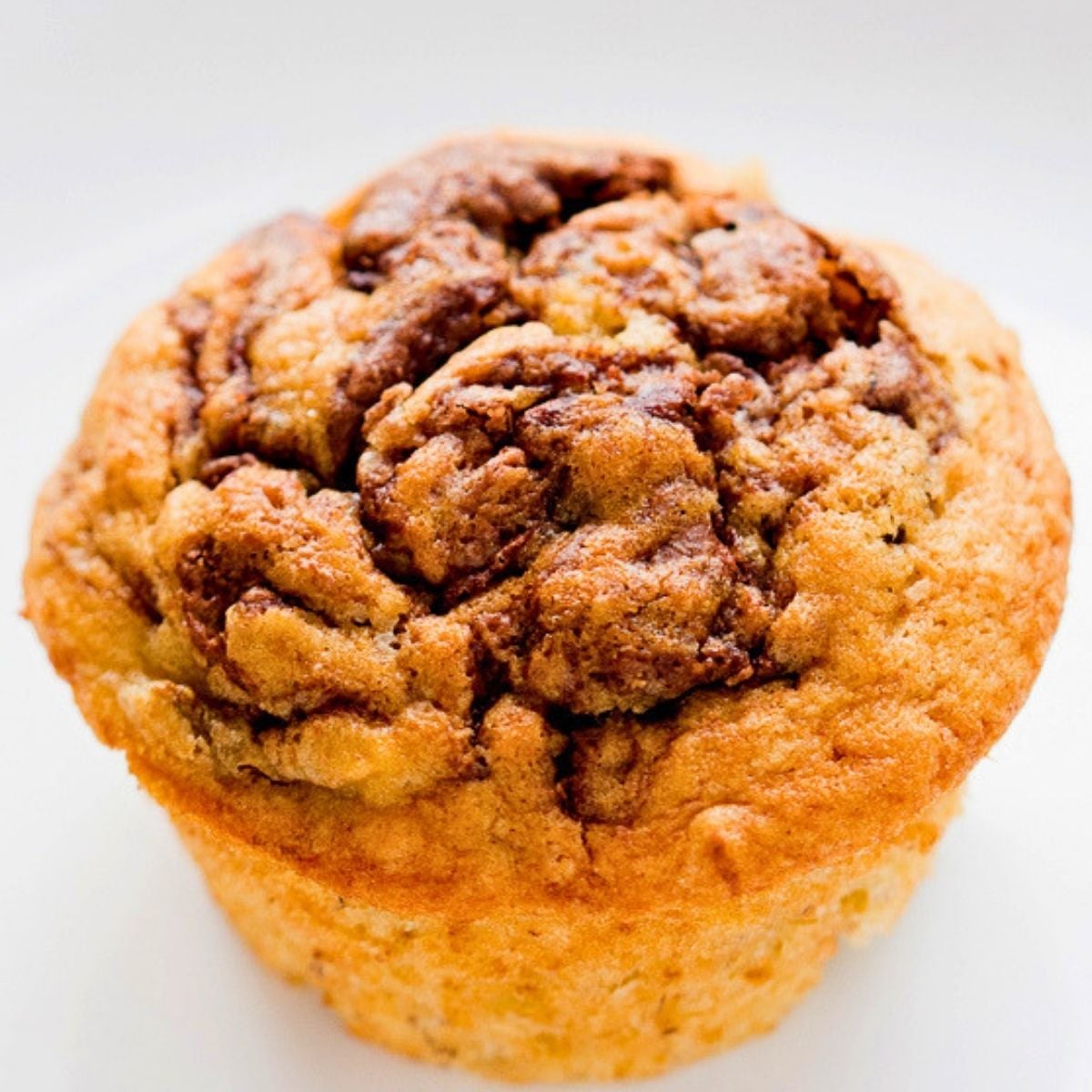 soft banana muffins topped with swirled Nutella