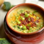 bowl of instant pot cheddar broccoli and potato soup