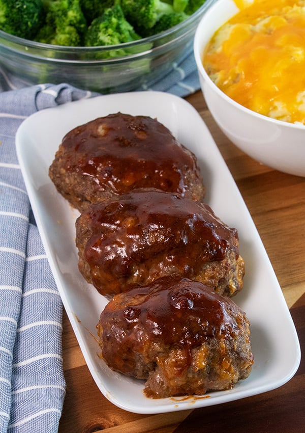 juicy bbq cheddar meatloaf made with ground beef on a white plate