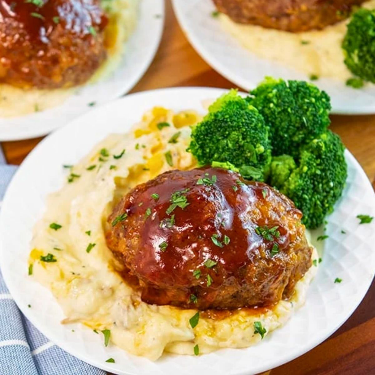 easy mini meatloaves with cheddar and BBQ sauce served with mashed potatoes and broccoli.