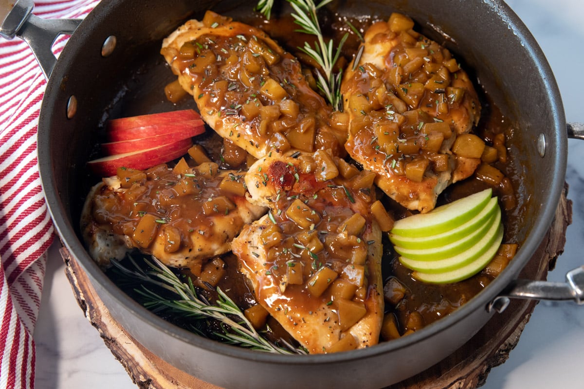pan of chicken with apple cider sauce