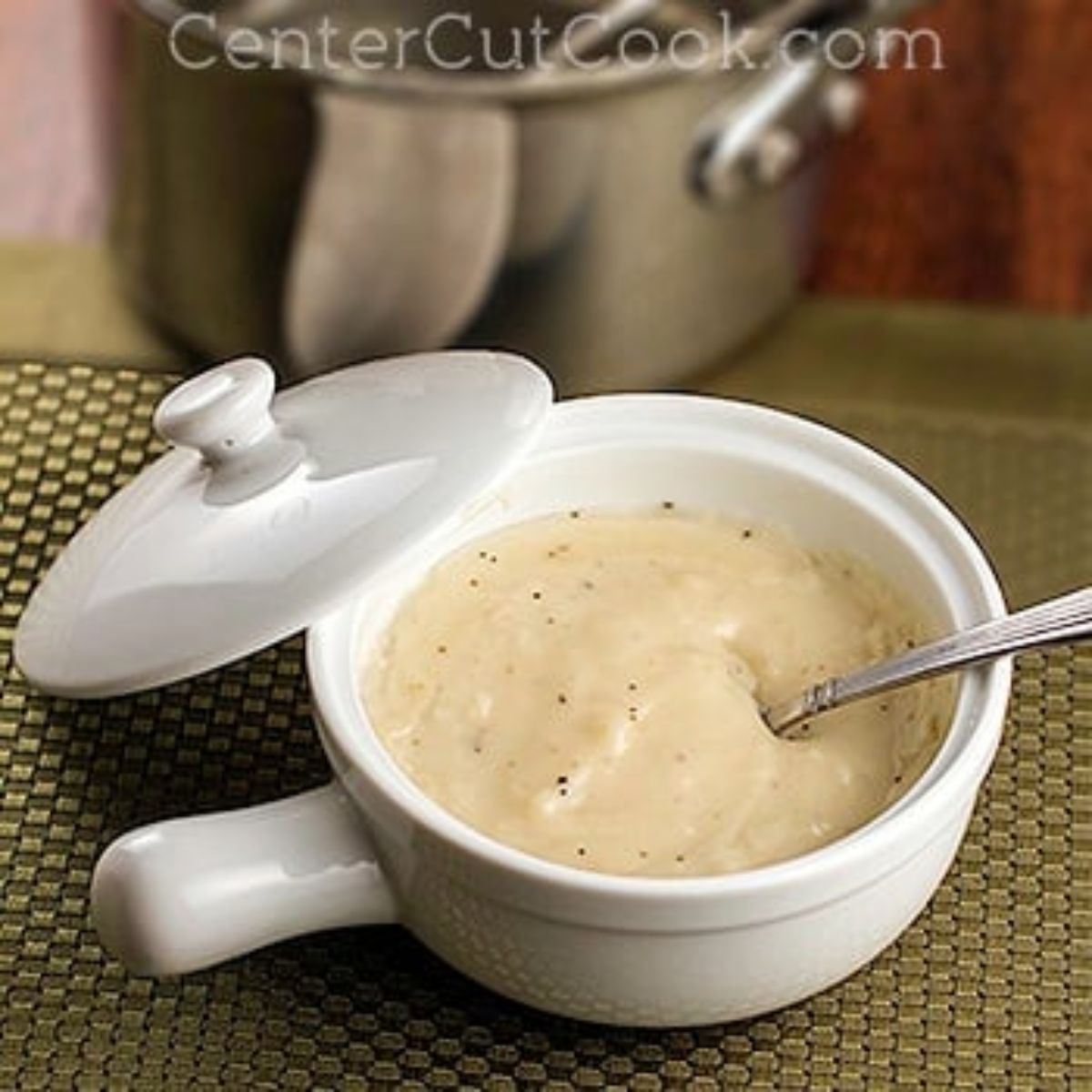 Bowl of cream soup substitute with spoon and lid