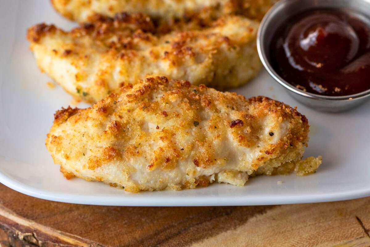 plate of air fryer parmesan crusted chicken with dipping sauce