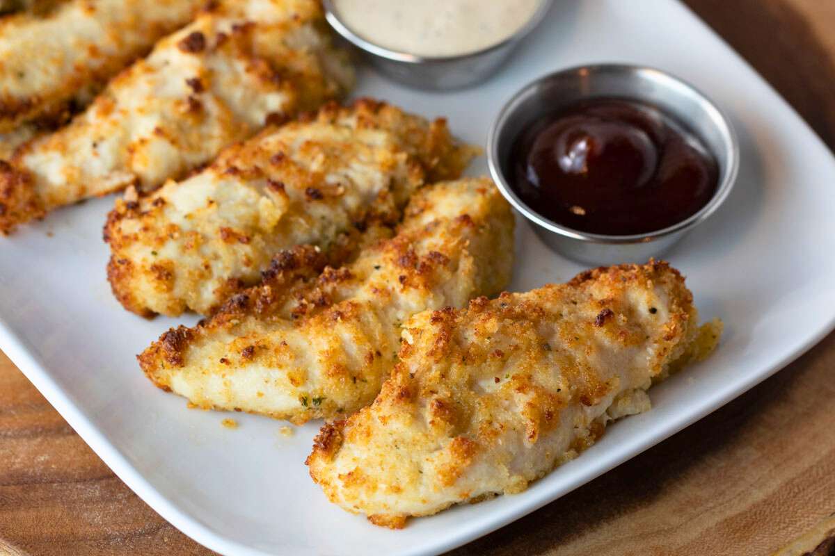 plate of air fryer parmesan crusted chicken with dipping sauce