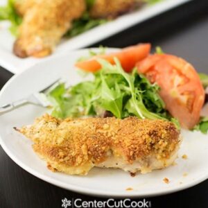 Parmesan Crusted Chicken on a plate with salad