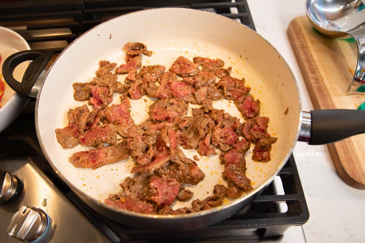 large skillet with flank steak