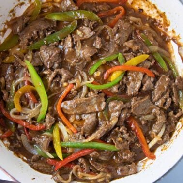 overhead of how to make pepper steak and onions