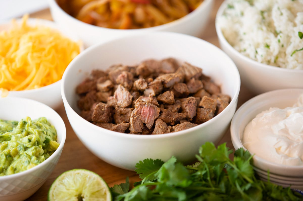 bowls of air fryer steak fajita ingredients