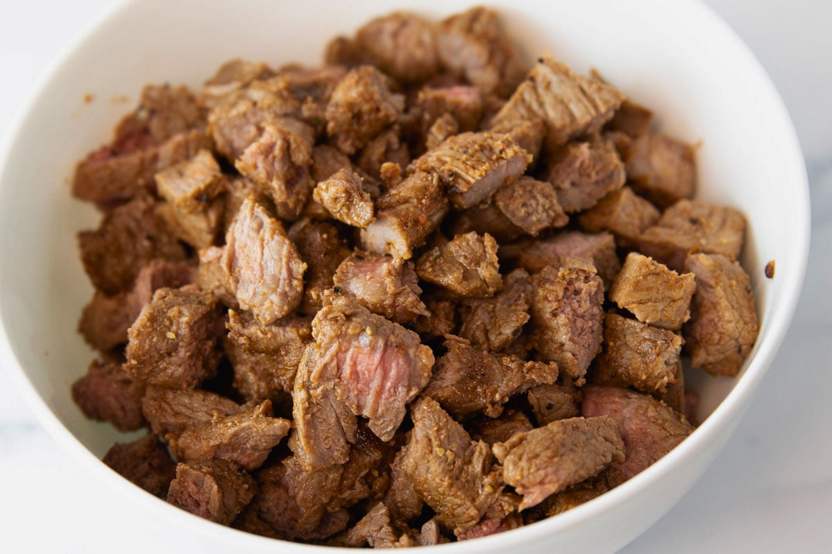 bowl of air fryer steak for burritos and fajitas