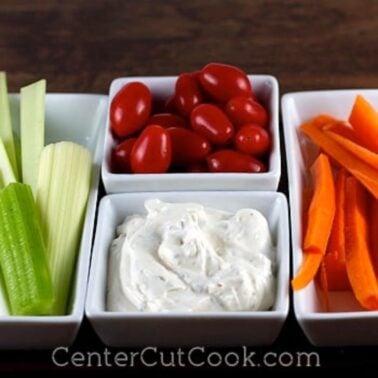 bowls of fresh vegetables and a bowl of classic ranch dip