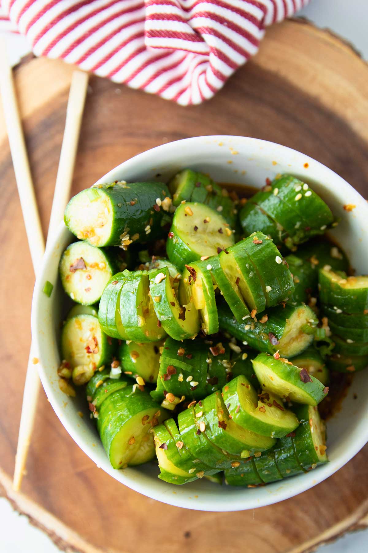 bowl of spiral cucumber salad with asian dressing.