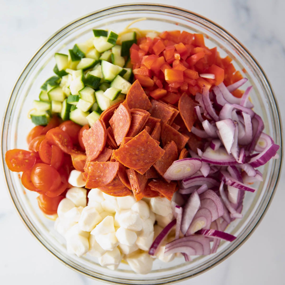 bowl of ingredients for spaghetti pasta salad