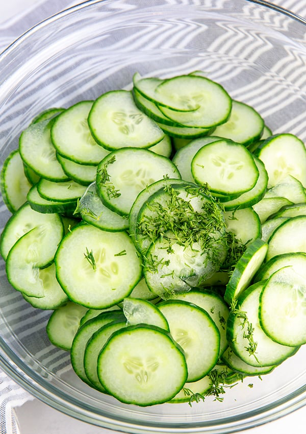 thinly sliced cucumbers with dill