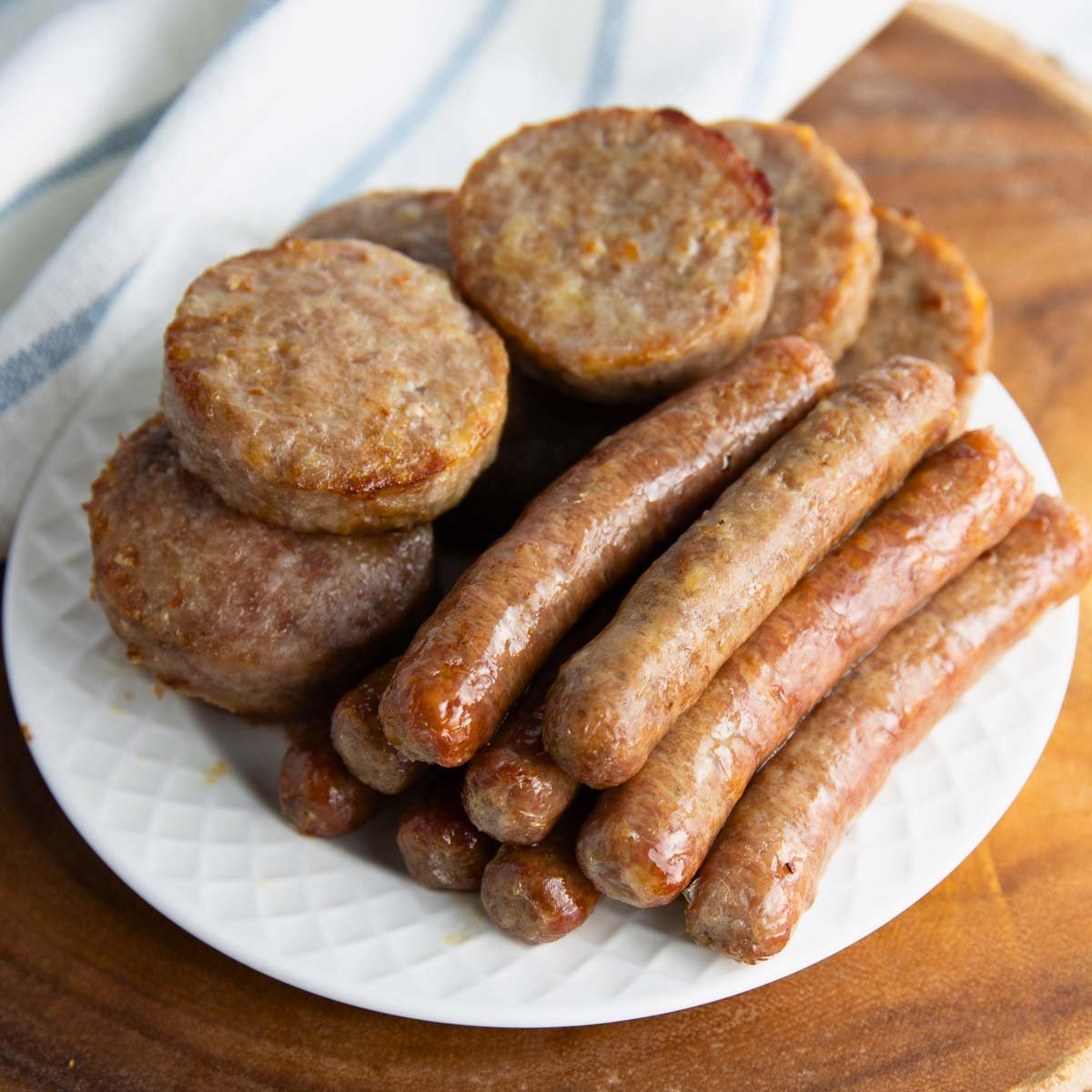 golden brown sausage patties served with eggs and toast for breakfast.
