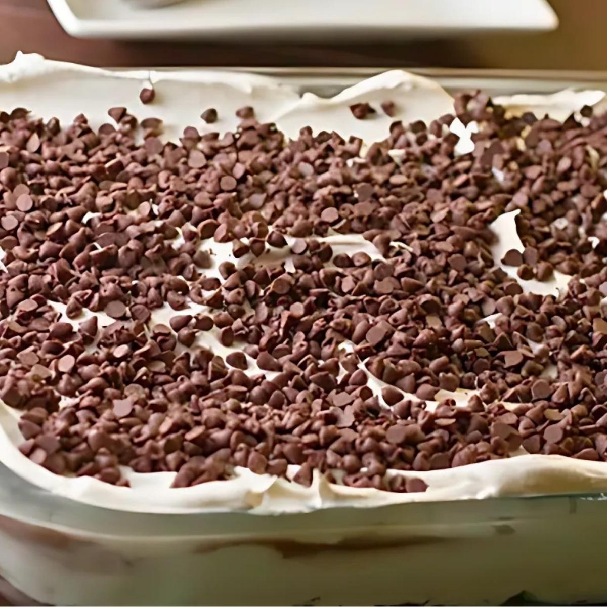 no-bake chocolate lasagna in a 9x13 inch baking dish with layers of chocolate pudding and whipped cream.