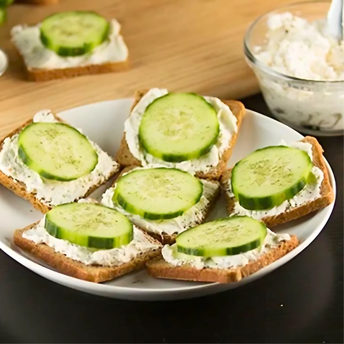 cucumber sandwiches on a plate, perfect. for baby showers and tea parties