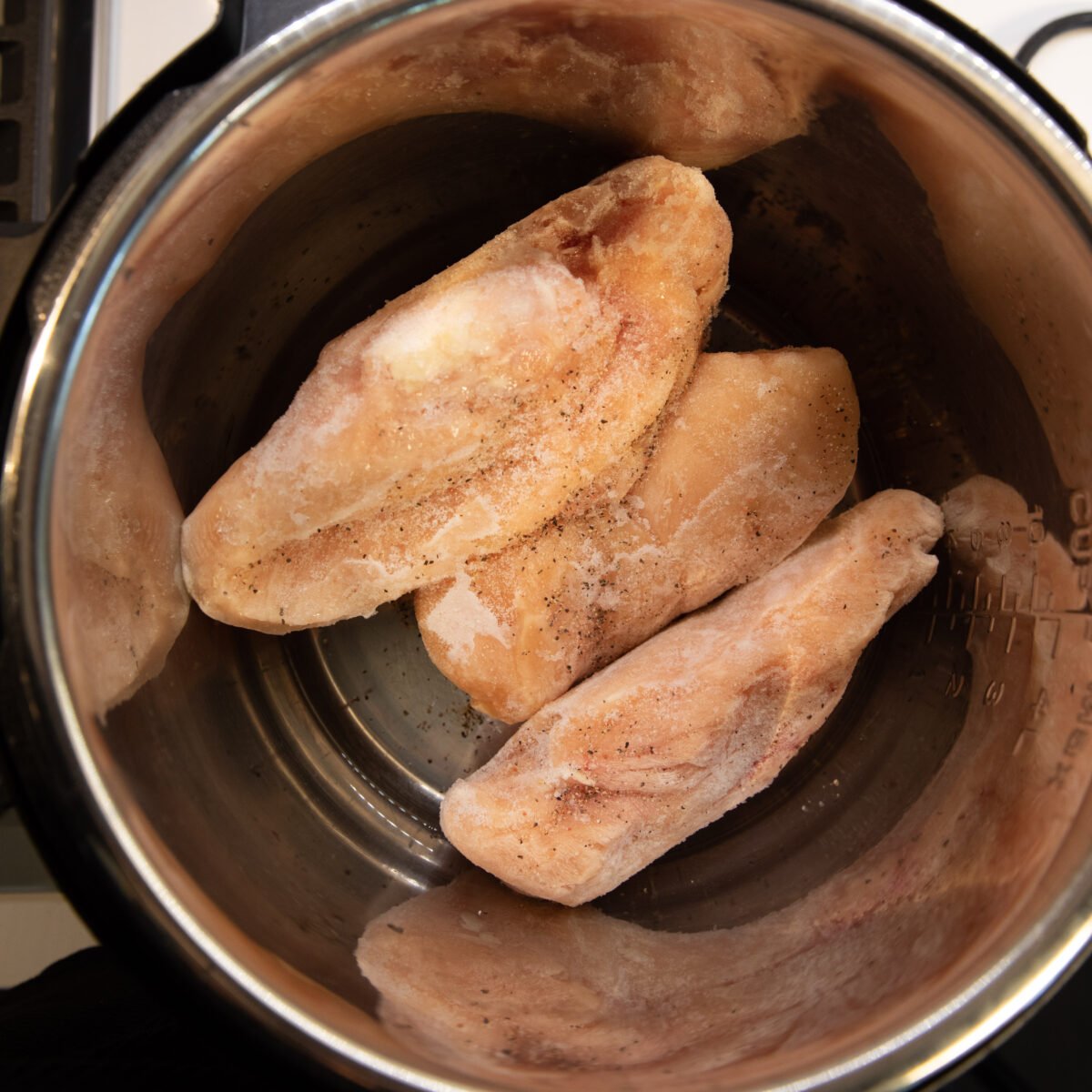 frozen chicken breasts in the Instant Pot before cooking.