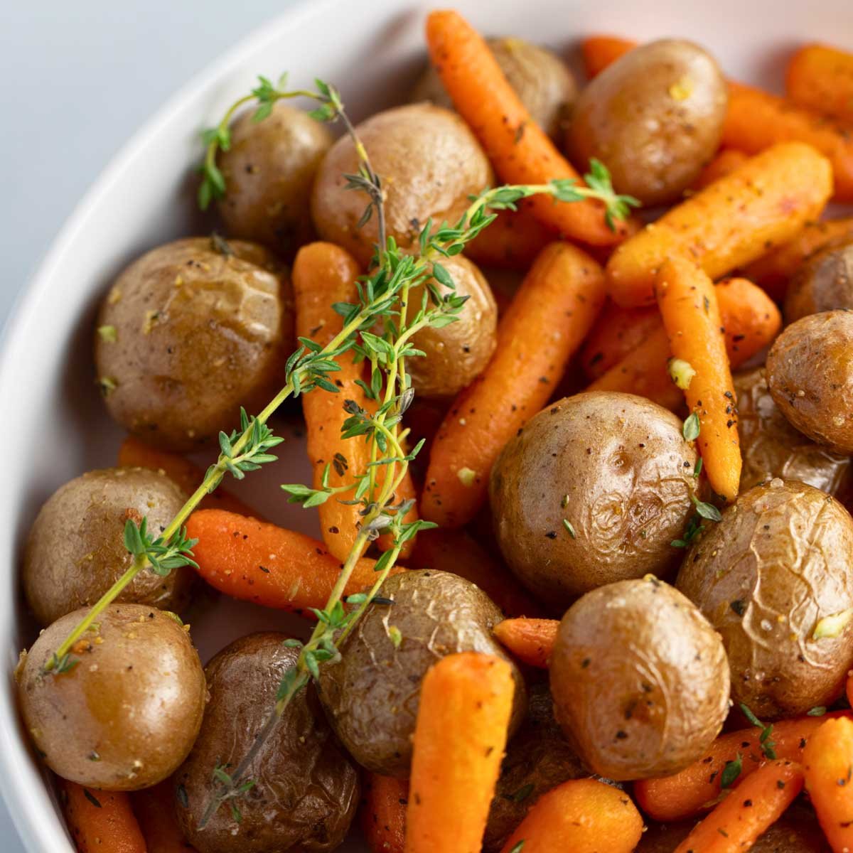 close-up of roast baby potatoes and carrots