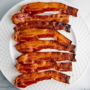 crispy baked bacon strips on a plate