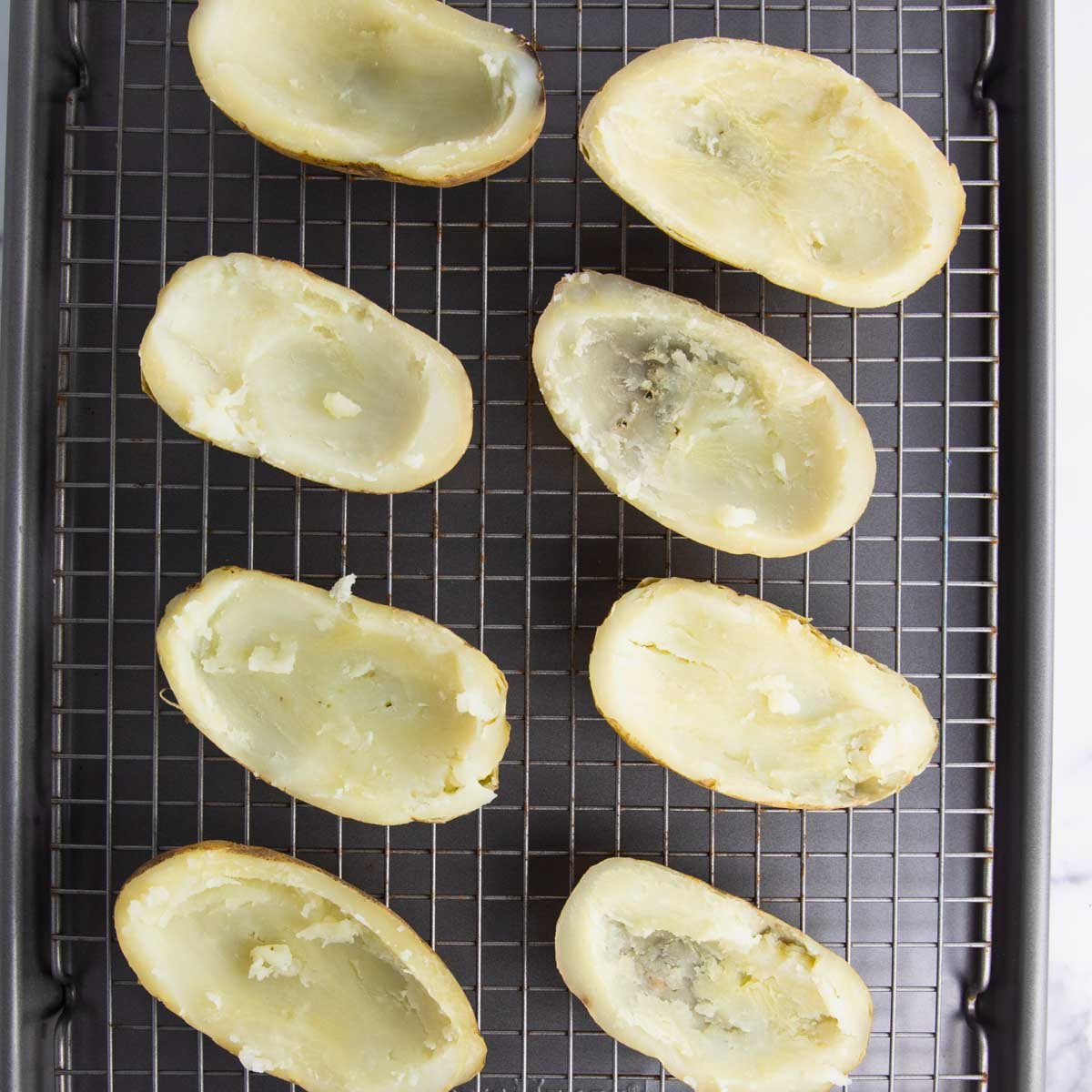 potato skins prepared for the broiler with butter and salt and pepper