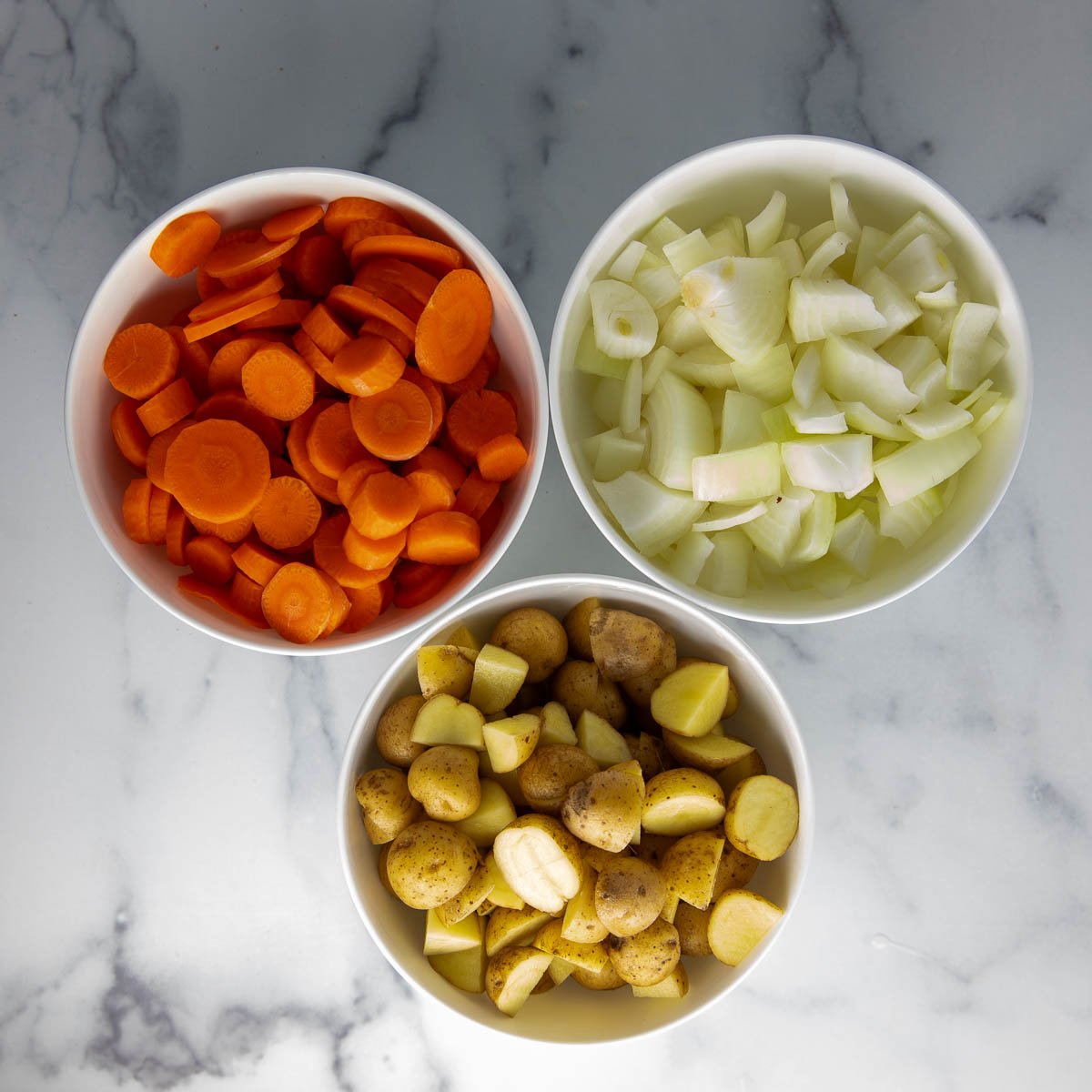 chopped potatoes, carrots, and onions