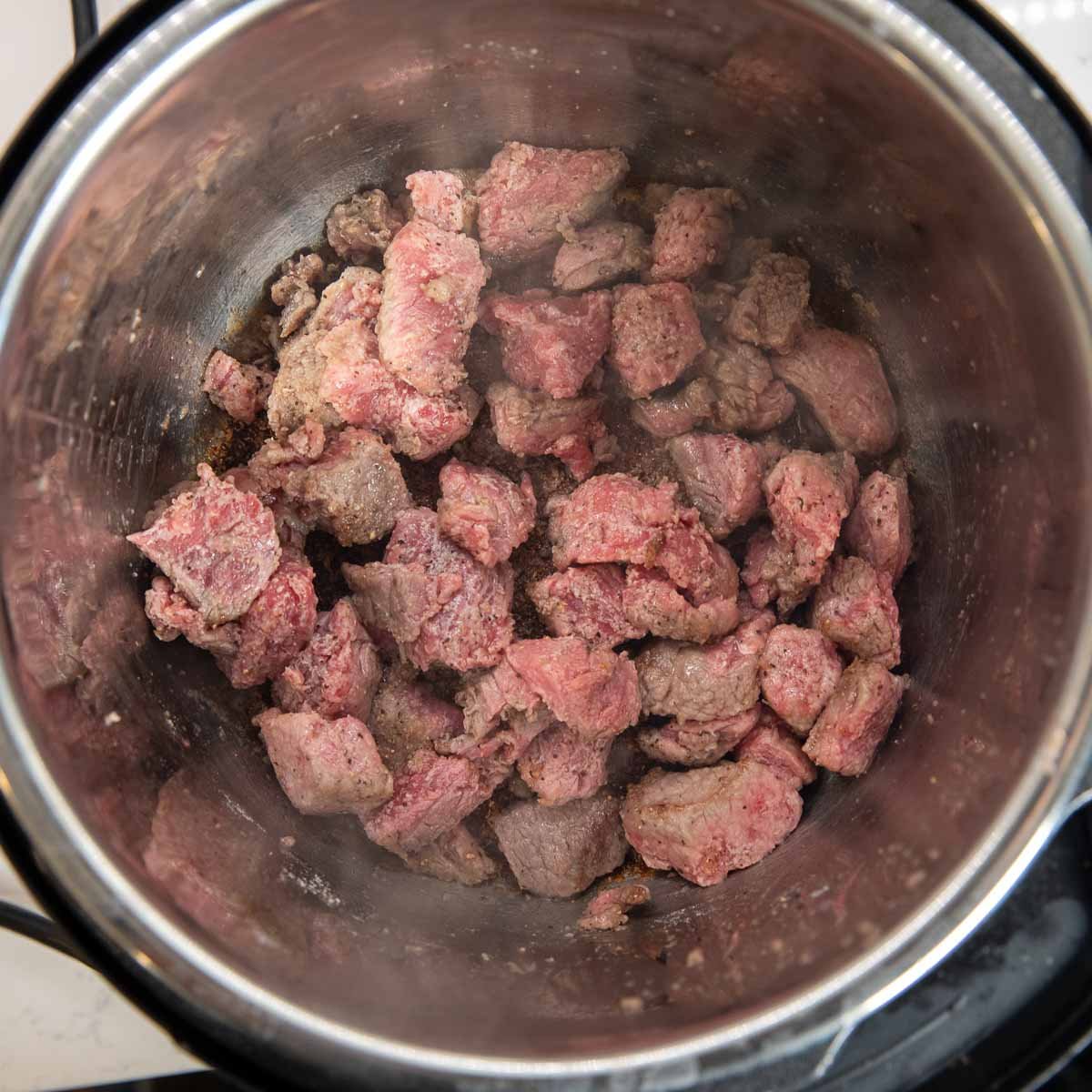 beef searing I the Instant Pot until browned.