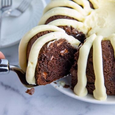moist and rich chocolate chocolate chip nothing Bundt Cake topped with thick cream cheese frosting.