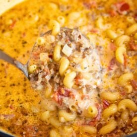 close-up of hearty Italian sausage soup with a creamy broth