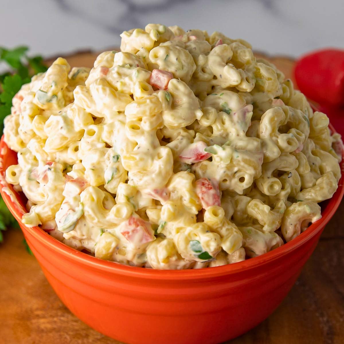 creamy macaroni salad with celery, red pepper and parsley.