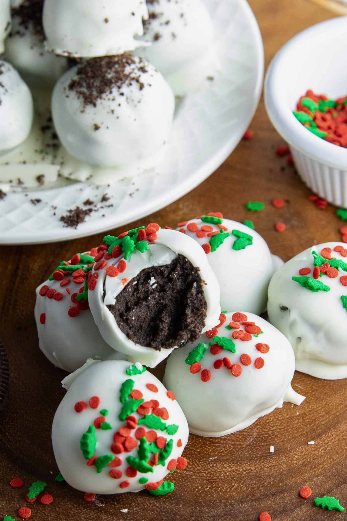 close-up of oreo truffles decorated with Christmas sprinkles.