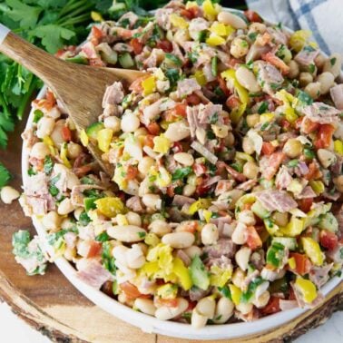 Italian Dense Bean Salad with Salami, Parmesan, banana peppers and fresh vegetables.
