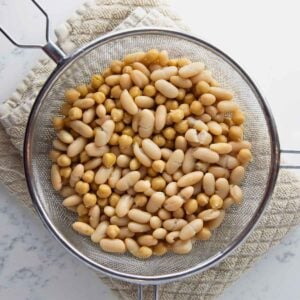 drained and rinsed chickpeas and cannellini beans for dense bean salad.